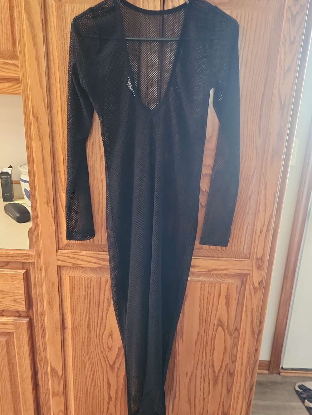 Bozzolo sheer black mesh jumpsuit with long sleeves and a plunge neckline Medium